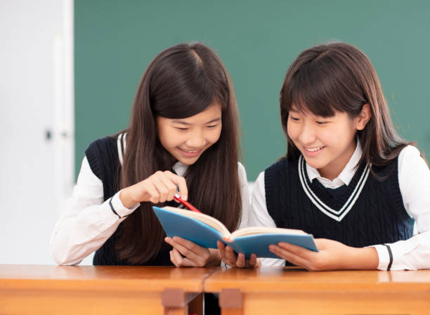 istock teenagers girl student studying in classroom 990711832