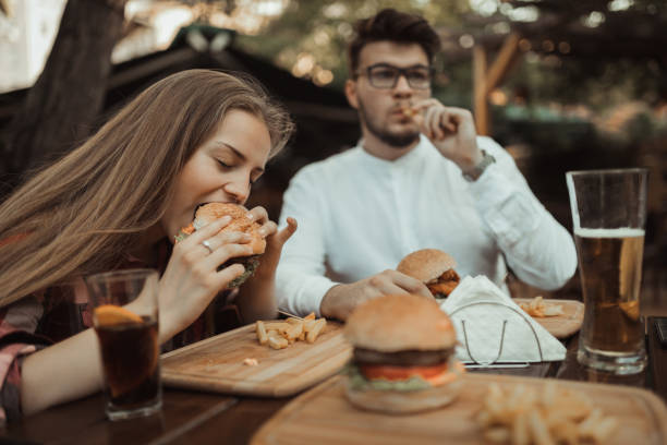 istock Young people eating and having fun in the pub 990712338