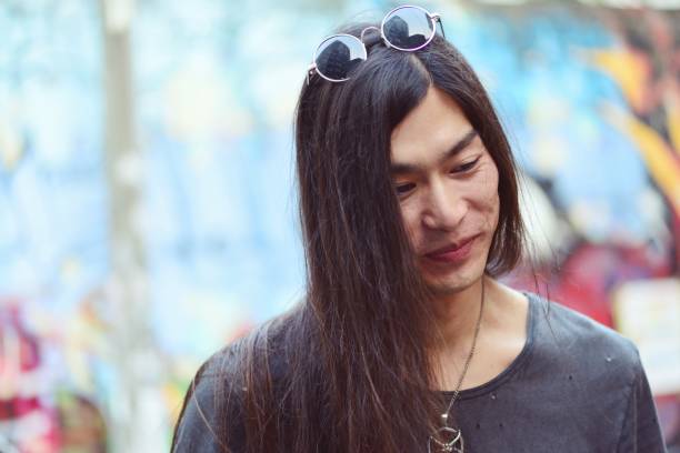 istock Long haired man smiling faintly 990718790