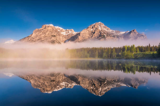 istock Foggy Morning at Wedge Pond Kananaskis, Alberta Canada 990738684