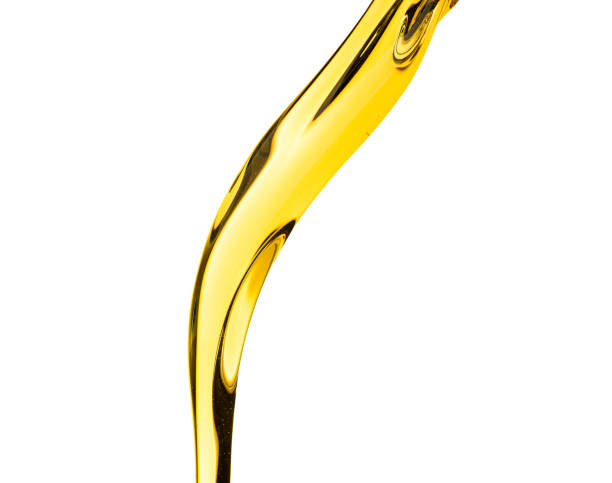 istock Pouring splash oil car motor or vegetable olive isolated on white background photo object design 990741300
