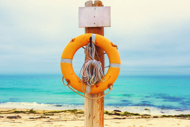 istock Lifebuoy on the beach 990757874