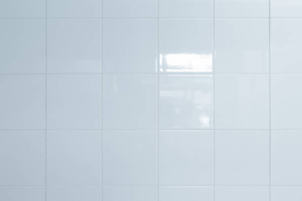 istock White and Grey the tile wall high resolution real photo or brick seamless and texture interior background. 990778360