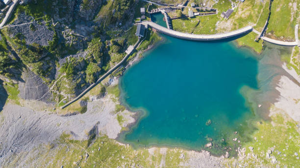 Up and down drone aerial view of the small and lower Lake Barbellino an alpine artificial lake. Italian Alps. Italy stock photo