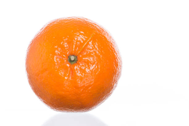 A plump tangerine sits freshly peeled, its bright color inviting a delicious taste and refreshing experience.