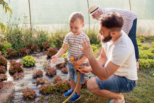 istock Father with his son working in the garden 990798740