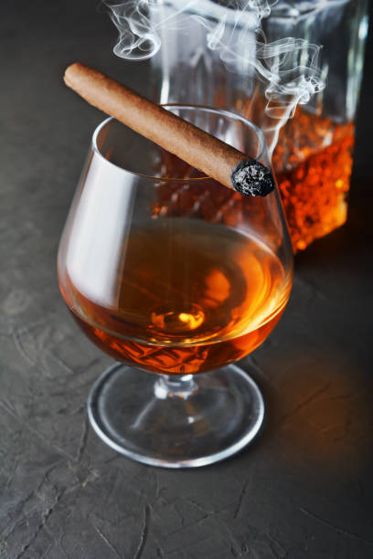 istock Strong alcoholic drink cognac in sniffer glass and crystal decanter 990821746