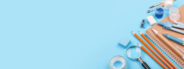 istock School stationary on blue background. 990826000