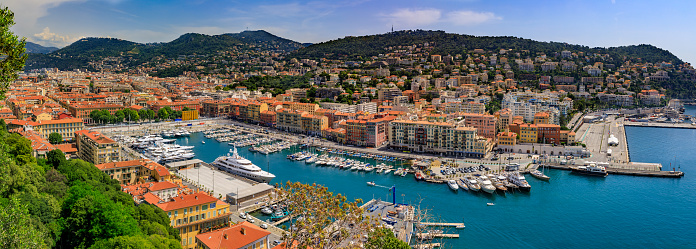 Panoramic view of boats and coastline in Nice port on the Mediterranean Sea, Cote d'Azur in Nice, France