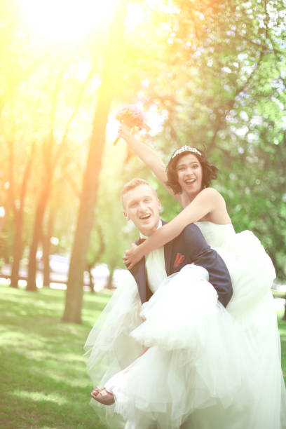 istock couple playing in the Park on a Sunny day 990837230