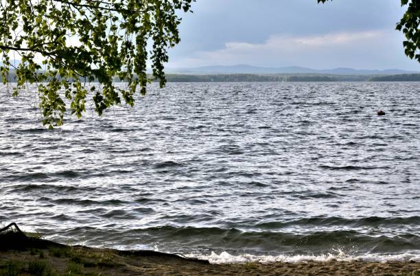 istock foggy far shore of the lake 990840344