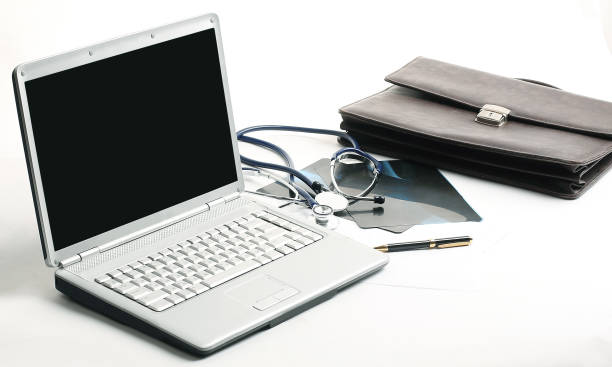 istock closeup. laptop and stethoscope in the workplace therapist 990843500