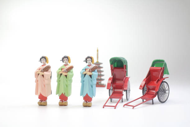 istock Mini statue and red vintage oriental rickshaw cab 990844030