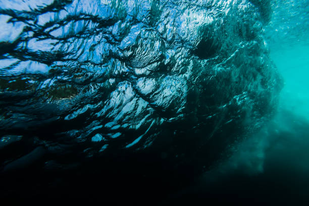 istock Beautiful texture of barrel wave is underwater. 990844970