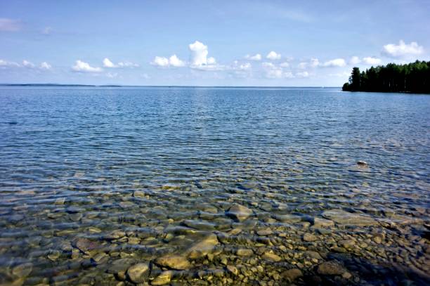 istock sunny morning on the lake with clear water 990847760
