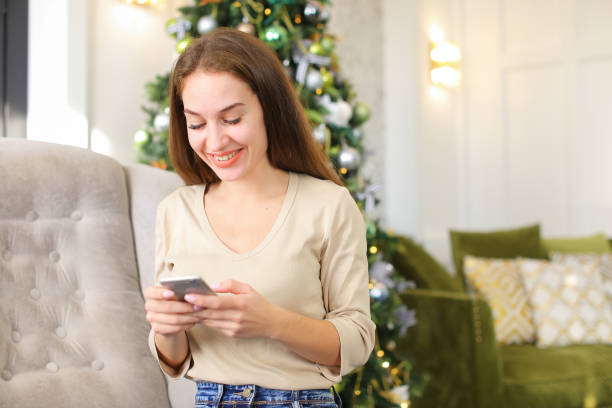 istock architect female using smartphone to watch photos in social netw 990856204