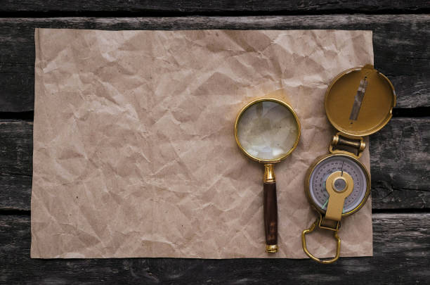 istock Blank paper page and magnifying glass. 990864224