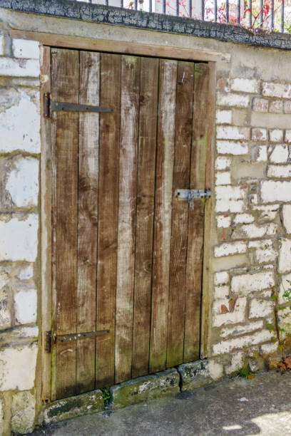 istock Old Weathered wooden door 990864336
