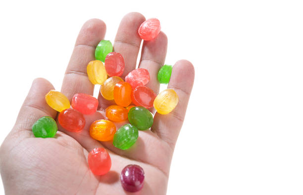 istock Colorful Candies on Hand 990864678