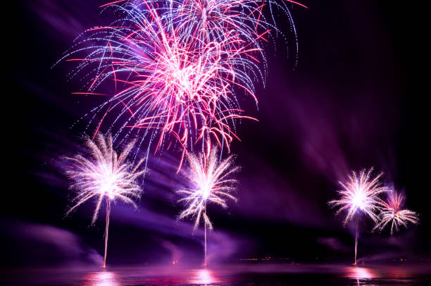 istock Brightly Colorful Fireworks shot over the sea 990865168