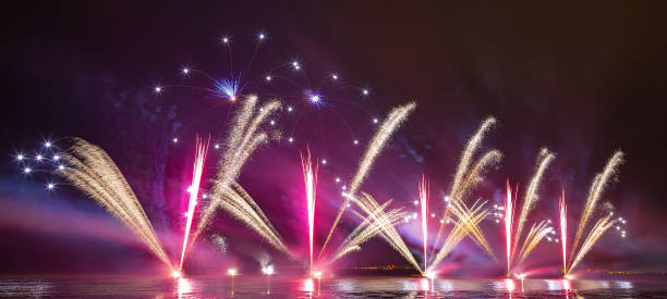 istock Brightly Colorful Fireworks shot over the sea 990865178