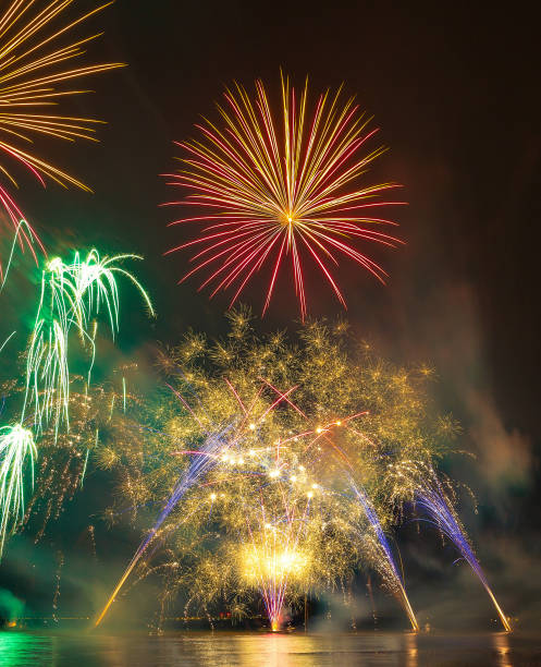 istock Brightly Colorful Fireworks shot over the sea 990865194