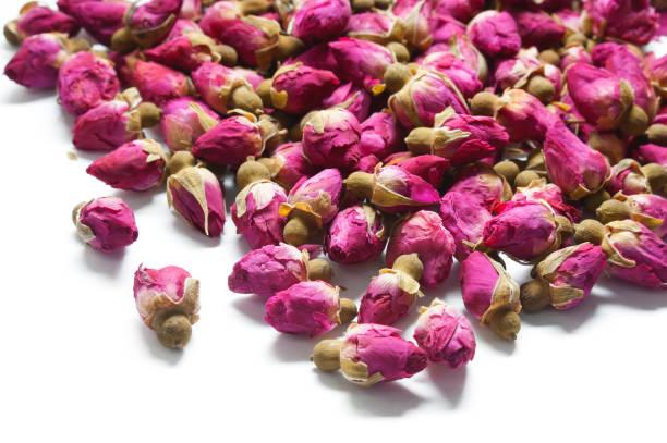 istock Dry pink roses buds isolated on white 990873076