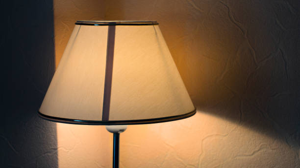 istock Vintage night lamp on the table with warm yellow light 990873542