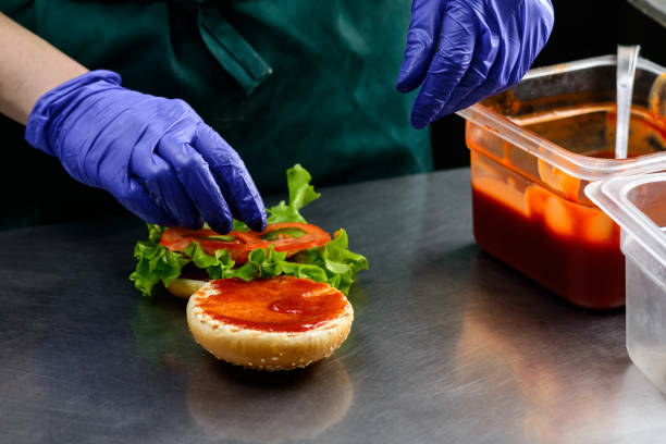 istock chef in sterile gloves prepares a vegetarian burger 990877184