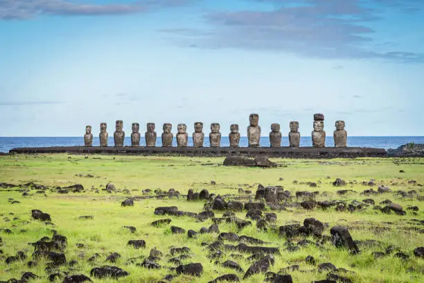 Famous Ahu Tongariki, all fifteen standing Moai Statues side by side in a row in late afternoon light. Easter Island, Isla de Pascua, Polynesia, Chile, Oceania