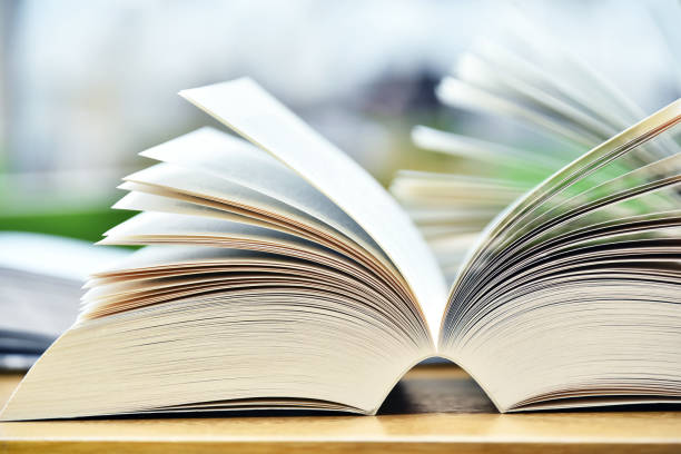 istock Books lying on the table in the public library 990888406