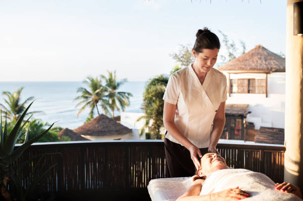 istock Massage therapist massaging at a spa 990889454