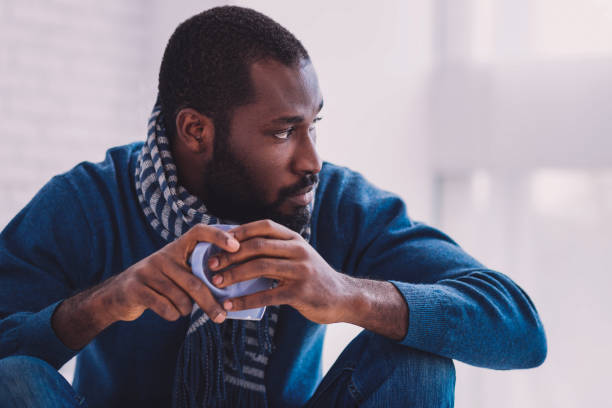 istock Serious African male looking aside 990892854