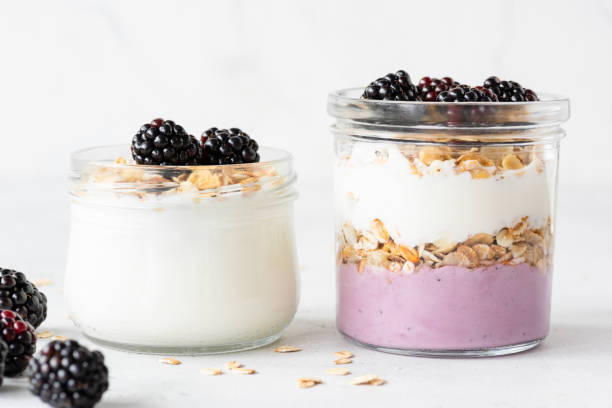 istock Overnight oats or healthy breakfast parfait with yogurt and berries 990893714