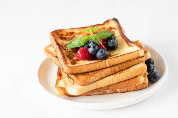 istock French toast with berries isolated on white 990893928