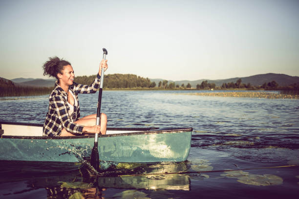 istock YOung Woman Canoeing on the Lake 990894040