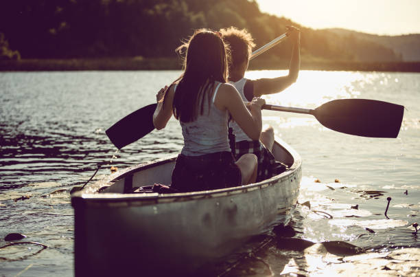 istock Two Women Canoeing on the Lake 990894118