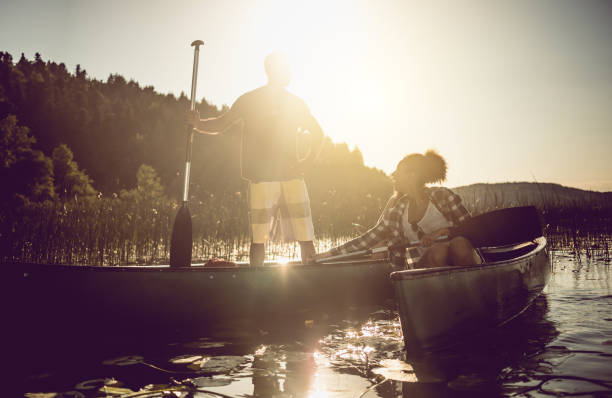 istock Couple Canoeing on the Lake 990894164