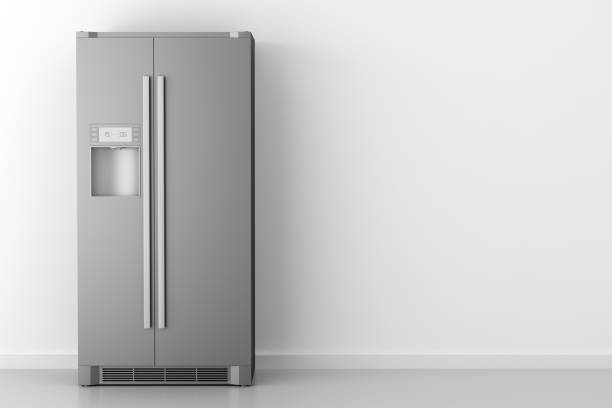 modern fridge in front of white wall modern fridge in front of white wall refrigerator stock pictures, royalty-free photos & images