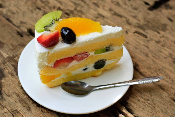 istock Fruity Cake on old wooden floor. 990897276