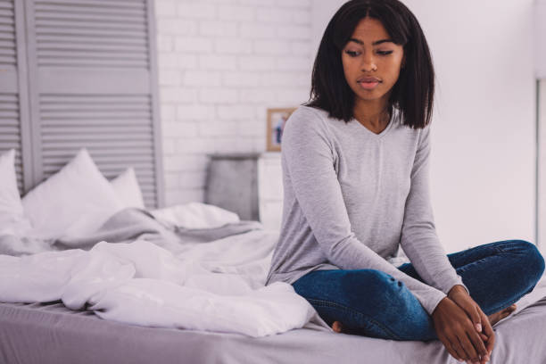istock Upset female person being deep in thoughts 990897586