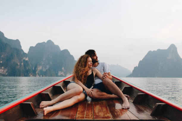 istock Couple boating on a quiet lake 990905494