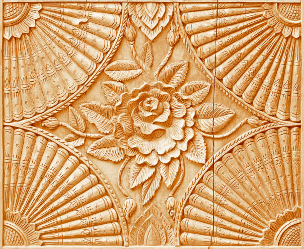 istock Pattern of flower carved on wood background 990906668