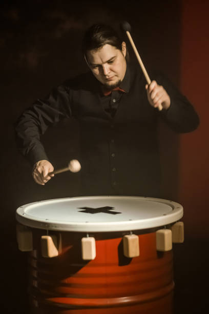istock Young Male Drummer is Playing Rhythm on Drum 990939356