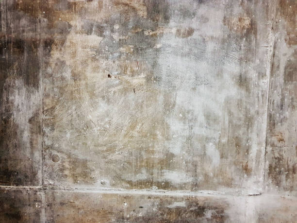 istock Scratched old reinforced concrete surface as industrial background 990950480