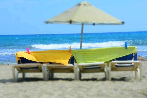 istock Towels and parasols on the beach 990965108