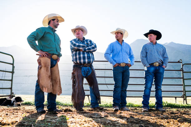 istock Wide low angle early morning sunlight over mountains ranchers talk 990972456