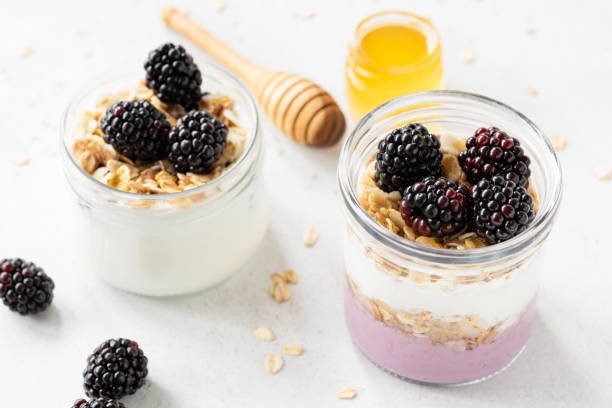 istock Greek yogurt with granola, blackberries and honey 990973178
