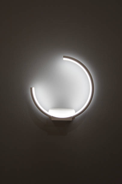 istock LED decoration lights idea on wall create shape with light and shadow. Modern wall lamp in the form of a ring isolated on a gray background 990980114