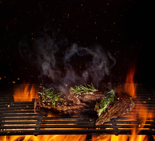istock Beef steaks on the grill with flames 990984772